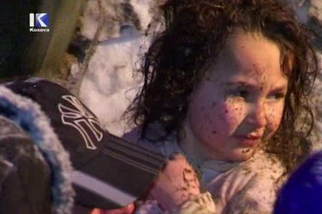 A TV still of the young girl after she was pulled from the rubble of an avalanche-struck house today.