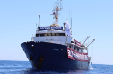 Stranded anti-migrant ship refuses help from migrant rescue vessel