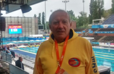 Spanish swimmer stays on blocks to observe minute's silence for attack victims