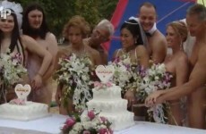 Video: Naked couples tie the knot in mass beach wedding