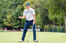 Spieth rides hot putter to share lead, McIlroy seven shots off him