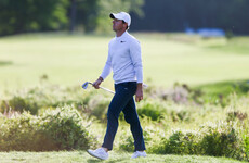 Johnson on the money as McIlroy drops back after edgy start to title defence