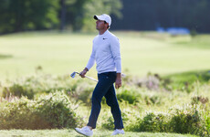 Frustrated Rory McIlroy misses the cut as newcomer Rahm leads in Boston
