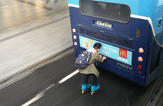 'Bus drivers were beeping wildly': Video captures rollerblader hitching ride on back of Dublin Bus