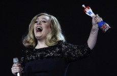 Adele lifts two prizes – and her middle finger – at Brit Awards