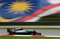 Hamilton claims pole in Malaysian GP, luckless Vettel to start from back of grid