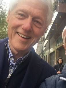 Bill Clinton is roaming the streets of Dublin in the storm like an absolute rebel