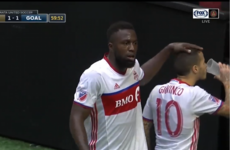 Giovinco takes a swig of beer launched from the crowd at Toronto FC team-mate Altidore