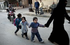 Syrians vote on new draft constitution as violence continues