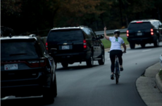 This picture of a cyclist giving Trump's motorcade the finger is going super viral