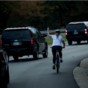 This picture of a cyclist giving Trump's motorcade the finger is going super viral