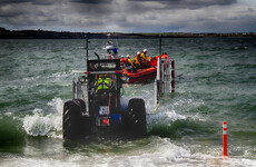 Two men rescued from sinking fishing boat that was 'almost underwater'