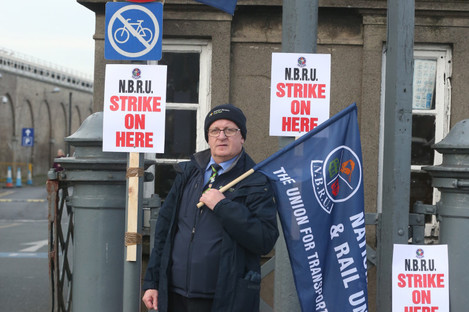Irish Rail Revenue Protection Officer Harry Delaney from Dublin joins train drivers and rail workers picket outside Heuston Train Station in Dublin.