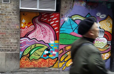 There's an underground poitín bar behind this mural in Dublin city centre