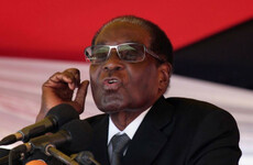 US journalist charged with attempting to overthrow Robert Mugabe after calling him 'selfish and sick'
