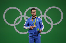 Iranian weightlifter auctions Olympic gold medal to help earthquake victims