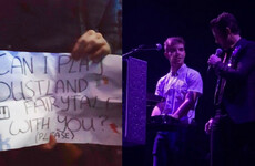 The Killers brought an Irish fan up on stage to play the keyboard after he held up this sign