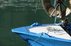 Italy fisherman 'throws migrant worker overboard' to evade police
