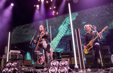 Queens of the Stone Age frontman under fire for kicking photographer during gig