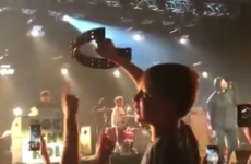 Liam Gallagher made a young fan's night by giving him a tambourine during a performance of Wonderwall