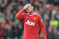 Rooney besieged in home by hooded mob