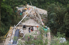 Nine workers dead after 450m-long bridge collapses in Colombian valley