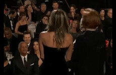 Dakota Johnson has explained *that* photo of her gawking at Angelina Jolie from the Golden Globes