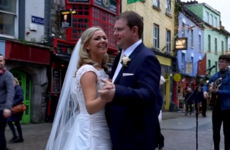 A newly-married couple had their first dance along to a busker on Shop Street