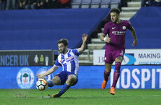 Paul Cook's Wigan dump Man City out of FA Cup after contentious Delph red