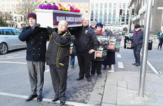 Protesters deliver a coffin to the door of PTSB, as government agrees to regulate vulture funds