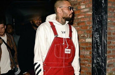 Don't worry, Chris Brown has explained why he was photographed with his hands around a woman's neck