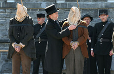 One of the men hanged for the infamous Mám Trasna murders has been pardoned by President Higgins