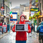 A DIT student is hitch-hiking through all 32 counties carrying a microwave for a really good cause