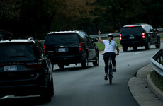 Woman fired for giving Trump the finger sues her former employer