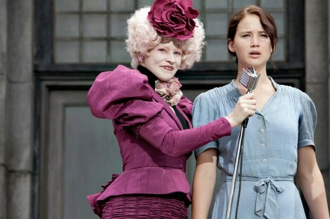 Effie Trinket (played by Elizabeth Banks) and Katniss Everdeen (Jennifer Lawrence) in The Hunger Games