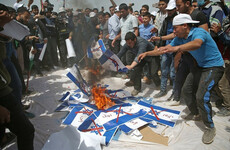 Tear gas and black smoke: Protesters are burning Israeli flags in Gaza