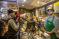 Starbucks CEO apologises after two black men arrested in café while waiting for a friend
