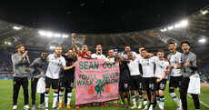 Liverpool celebrate Champions League semi-final win with flag paying tribute to injured Irish fan