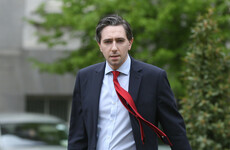 Harris says graphic posters hung outside his constituency office are upsetting to him and his family
