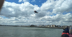 Coast Guard helicopter rescues three men who jumped into water at Clontarf's Wooden Bridge