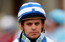 Former champion jockey left needing medical treatment after being struck in the face by fellow rider