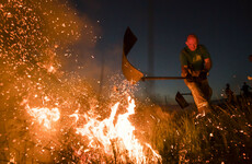Firefighters in England tackle 'aggressive' moorland wildfire after two blazes merge