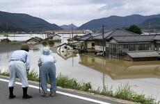 Death toll rises to at least 57 as torrential downpours devastate Japan
