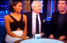 An old clip of Louis Walsh touching Mel B's bum on live TV is being criticised on Twitter