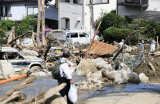 Japan rescuers carry out house-to-house searches as floods and landslides claim 141 lives