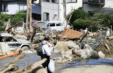 Japan rescuers carry out house-to-house searches as floods and landslides claim 141 lives
