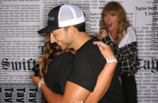 A couple got engaged during a Taylor Swift meet and greet, and her face was perfect
