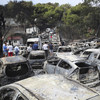Flames ravage Greek seaside as wildfires kill 74
