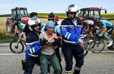 Police use 'tear gas' on Tour de France protesters who blocked route with bales of hay