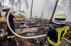 German firefighters stop spread of huge blaze but warn of ongoing threat